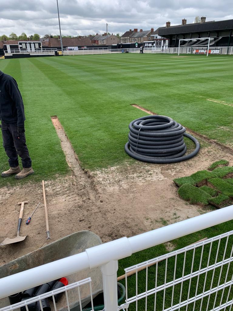 A closeup of the drainage being dug