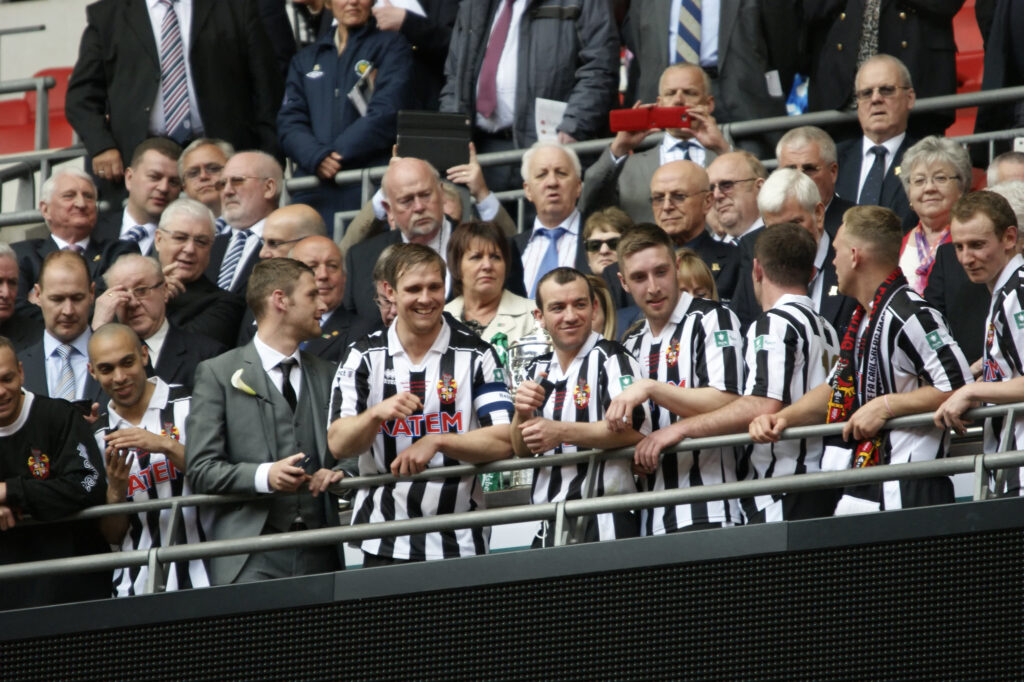 Spennymoor Town's players lift the FA Vase at Wembley