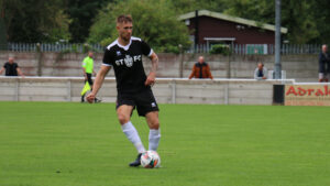 Finn Cousin-Dawson in action against Trafford