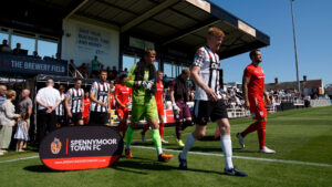 The teams come out for Spennymoor Town v AFC Telford United