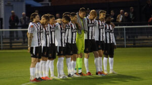 Spennymoor Town players pay their respects to Queen Elizabeth II