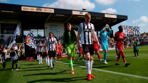 James Curtis leads the Spennymoor Town team out