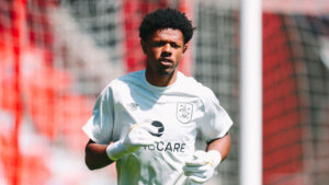 Huddersfield Town goalkeeper Giosue Bellagambi has joined Spennymoor Town on loan