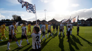 The players come out at The Brewery Field