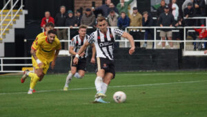 Spennymoor Town forward Glen Taylor scores a penalty against Banbury United