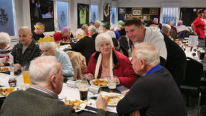 Luke Cowie chats with guests at Spennymoor Town's Community Christmas Dinner
