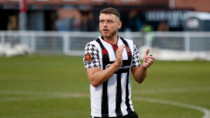 Spennymoor Town striker Paul Blackett clapping supporters