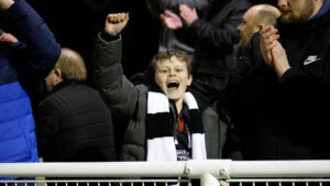 A young Spennymoor Town fan celebrates