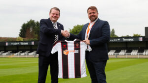 Spennymoor Town's Ian Geldard with Simon Corbett from Orangebox