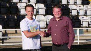 Spennymoor Town midfielder Connor Shanks with Managing Director Ian Geldard