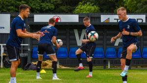 Spennymoor Town players warm-up at Newcastle Blue Star