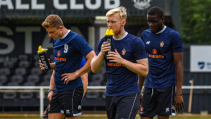 The Spennymoor Town players warm-up at Newcastle Blue Star