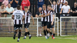 Spennymoor Town players celebrate Will Harris' winning goal against Hereford