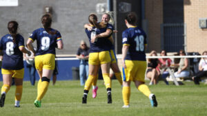 Spennymoor Town Ladies celebrate after scoring against Hartlepool United