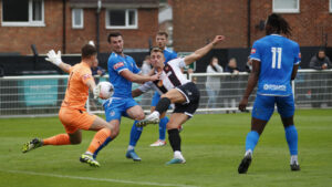 Spennymoor Town's Glen Taylor gets a show away against Marine
