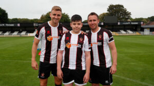 Twelfth Man Jacob Dean with Spennymoor Town players Glen Taylor and Mark Anderson