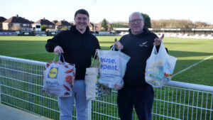 Spennymoor Town's Luke Cowie hands over food donations to Angel Trust