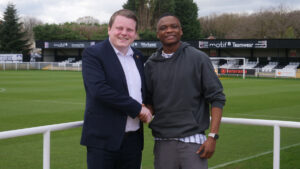 Spennymoor Town Managing Director Ian Geldard welcomes John Lufudu back to the Club