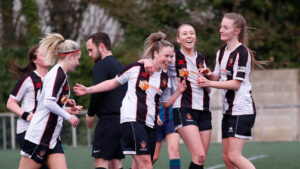 Spennymoor Town Ladies striker Caitlin Bates celebrates a goal with teammates