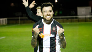 Spennymoor Town midfielder Callum Ross celebrates victory over Scunthorpe United