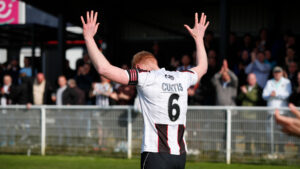 Spennymoor Town's James Curtis takes the applause from supporters
