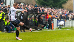 Spennymoor Town midfielder Matty Dolan takes a free kick