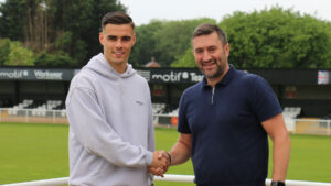 Spennymoor Town boss Graeme Lee with midfielder Isaac Fletcher