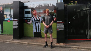 James Curtis in front of his Wall of Fame inistalment at Spennymoor Town