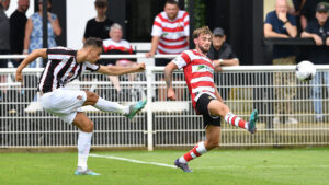 Spennymoor Town midfielder Isaac Fletcher shoots on goal against Doncaster Rovers