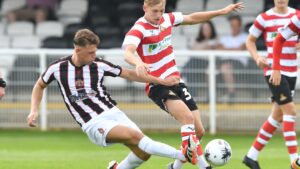 Spennymoor Town midfielder John Howard in action against Doncaster Rovers