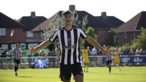 Spennymoor Town midfielder Isaac Fletcher celebrates a goal against Chester