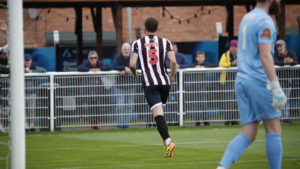 Spennymoor Town defender Dan Rowe celebrates his goal against Brackley Town