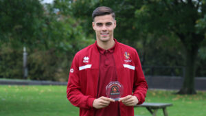 Spennymoor Town midfielder Isaac Fletcher with his Player of the Month award