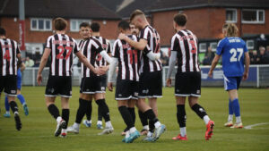 Spennymoor Town players celebrate their goal against Buxton