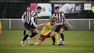 Spennymoor Town midfielder Isaac Fletcher in action against South Shields