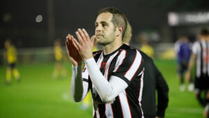 Spennymoor Town midfielder Matty Dolan clapping supporters