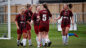 Spennymoor Town Ladies attacker Caitlin Bates celebrates a goal with teammates