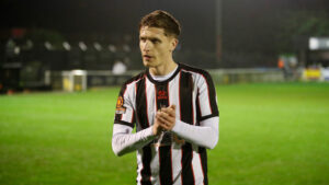 Spennymoor Town defender Michael Ledger applauds supporters