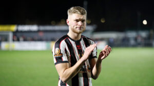 Spennymoor Town striker Aidan Rutledge applauds supporters after the draw at Scarborough Athletic