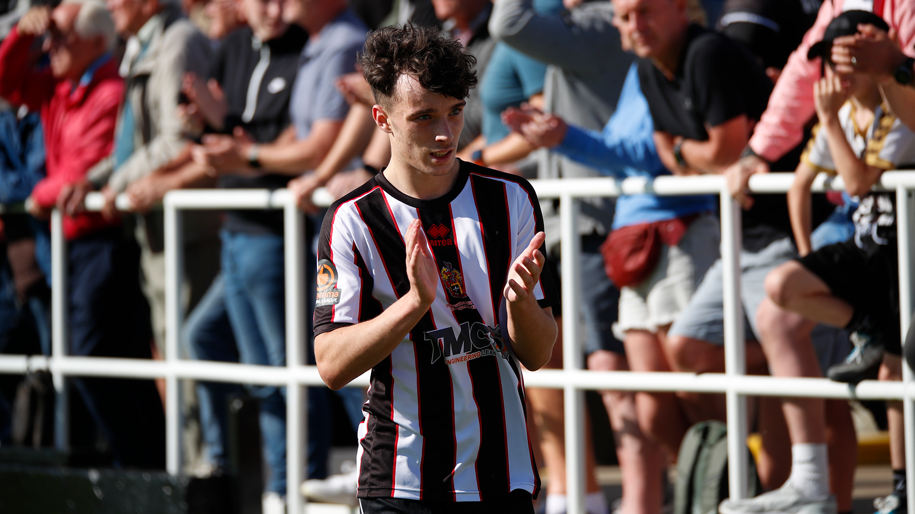 Spennymoor Town winger Corey McKeown applauds supporters