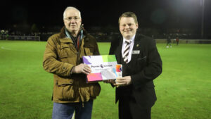 Brian Shippen is presented with the Community Captain award by Ian Geldard