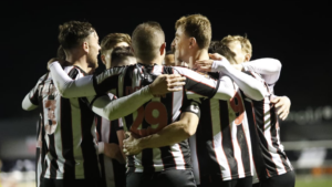 Spennymoor Town players celebrate a goal against Radcliffe