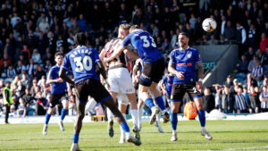 Spennymoor Town's Aidan Rutledge heads home the equaliser against Rochdale