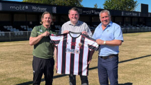 Matthew Coad and Chris Pomfret from Motif8 with Spennymoor Town's Ian Geldard