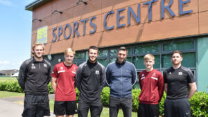 Spennymoor Town's Graeme Lee and Ben Beals with staff and students at Bede College