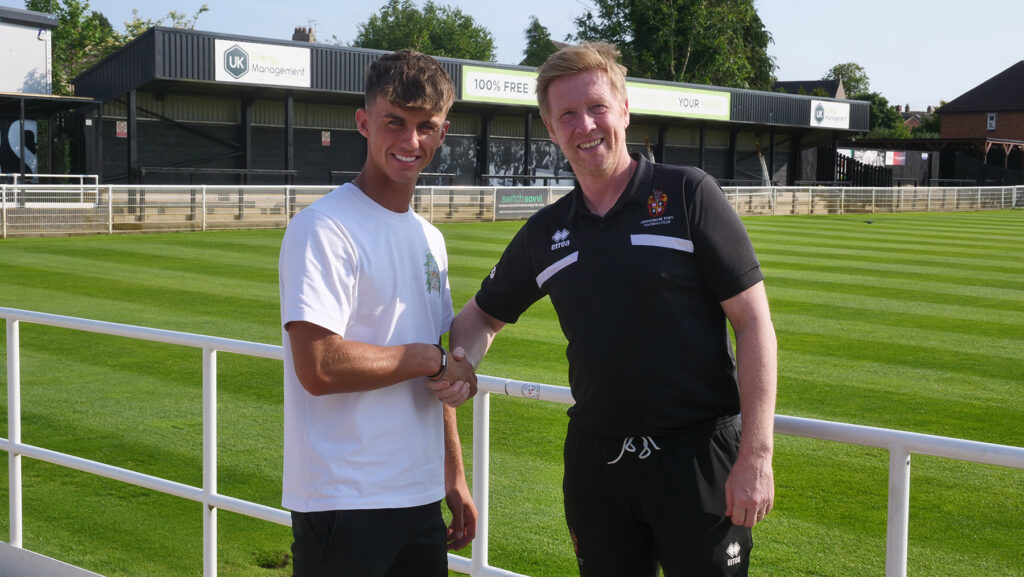 Spennymoor Town's Assistant Manager Ian Clark welcomes new signing Alfie Doherty