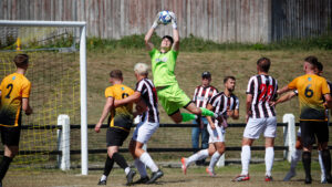 Spennymoor Town goalkeeper Brad James claims a cross against Crook Town