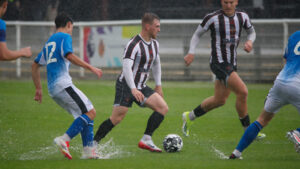 Spennymoor Town midfielder Mackenzie Heaney in action against Stockport County