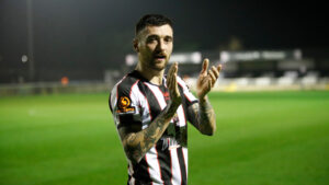Midfielder Callum Ross applauds fans at The Brewery Field