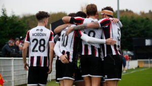 Spennymoor Town players celebrate a goal against Merthyr Town